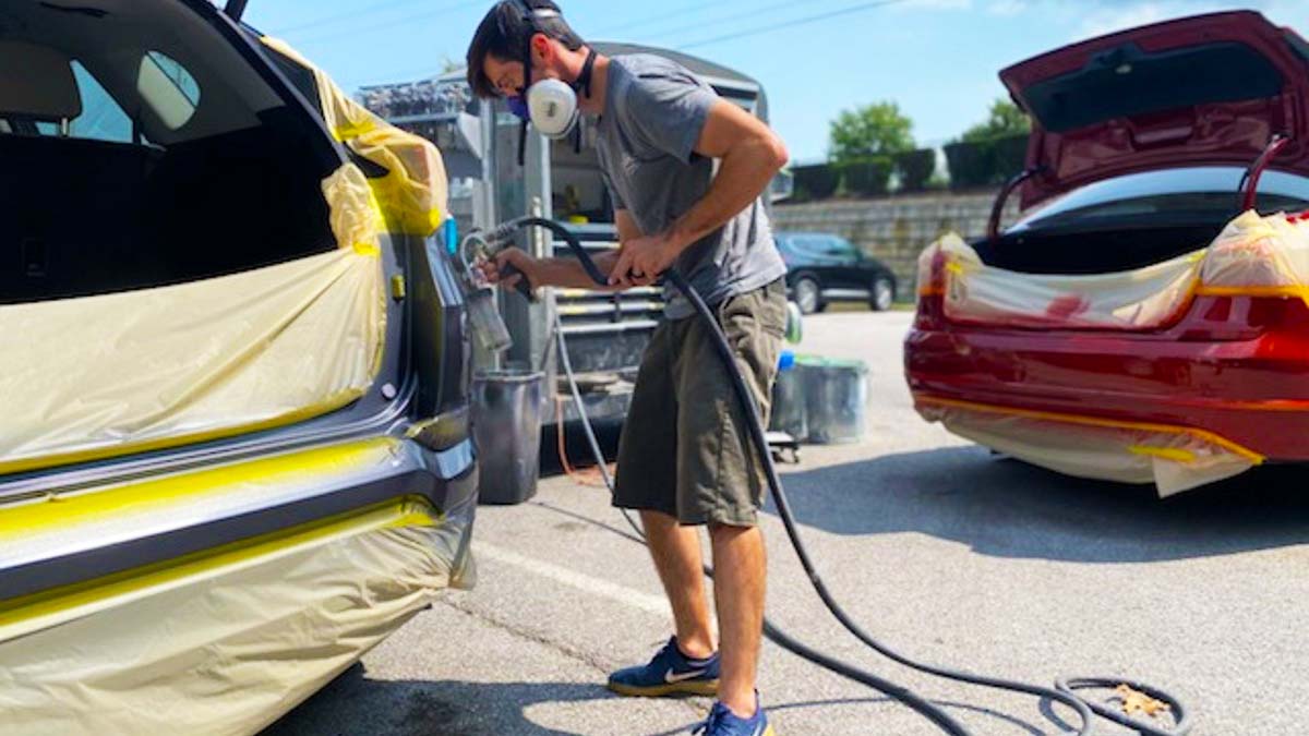 Mobile auto body repair in progress